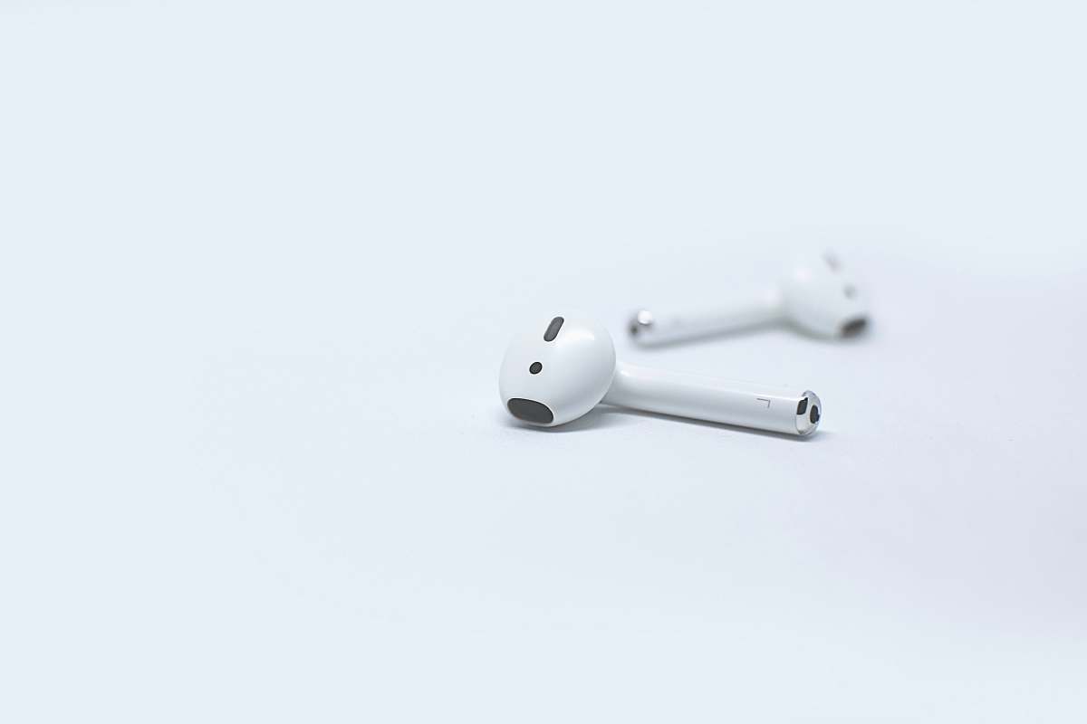 apple Apple AirPods on white surface airpod